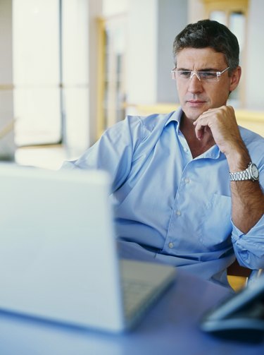 businessman using a laptop in an office